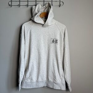 American Eagle AE Men's Long Sleeve Pullover Hoodie Cream Medium Spell-Out Arm
